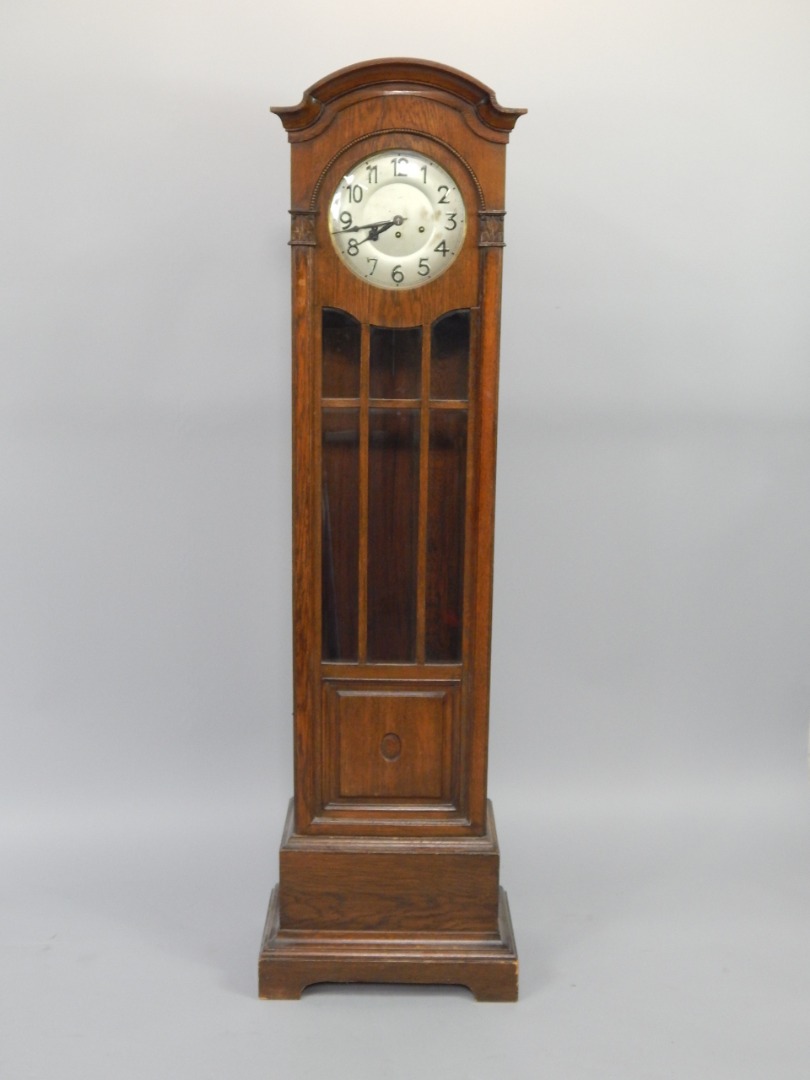 Appraisal: An early thC oak cased grandmother clock silvered dial bearing