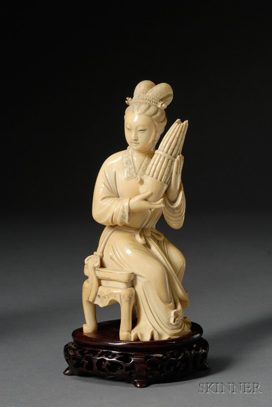 Appraisal: Ivory Carving China figure of a seated woman playing a