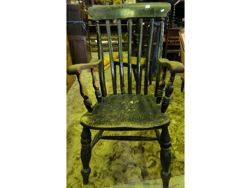 Appraisal: A Victorian Windsor lathe back kitchen elbow chair in elm