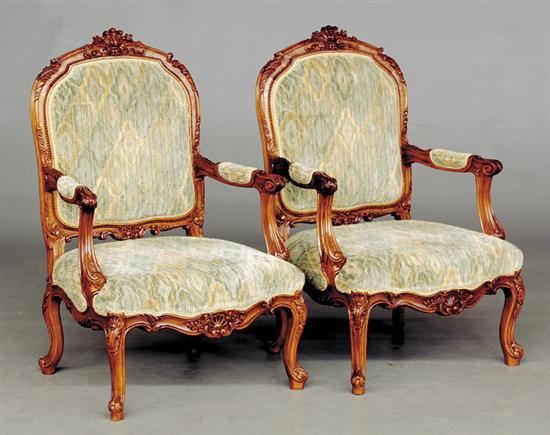 Appraisal: Pair George II style carved walnut armchairs early th centuryshaped