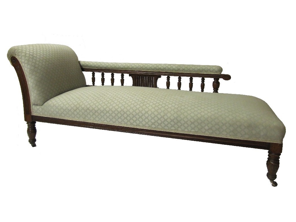 Appraisal: A late Victorian oak framed chaise longue upholstered in light