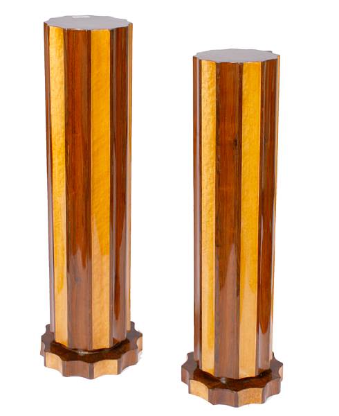 Appraisal: A pair of Art Deco style maple and rosewood pedestals