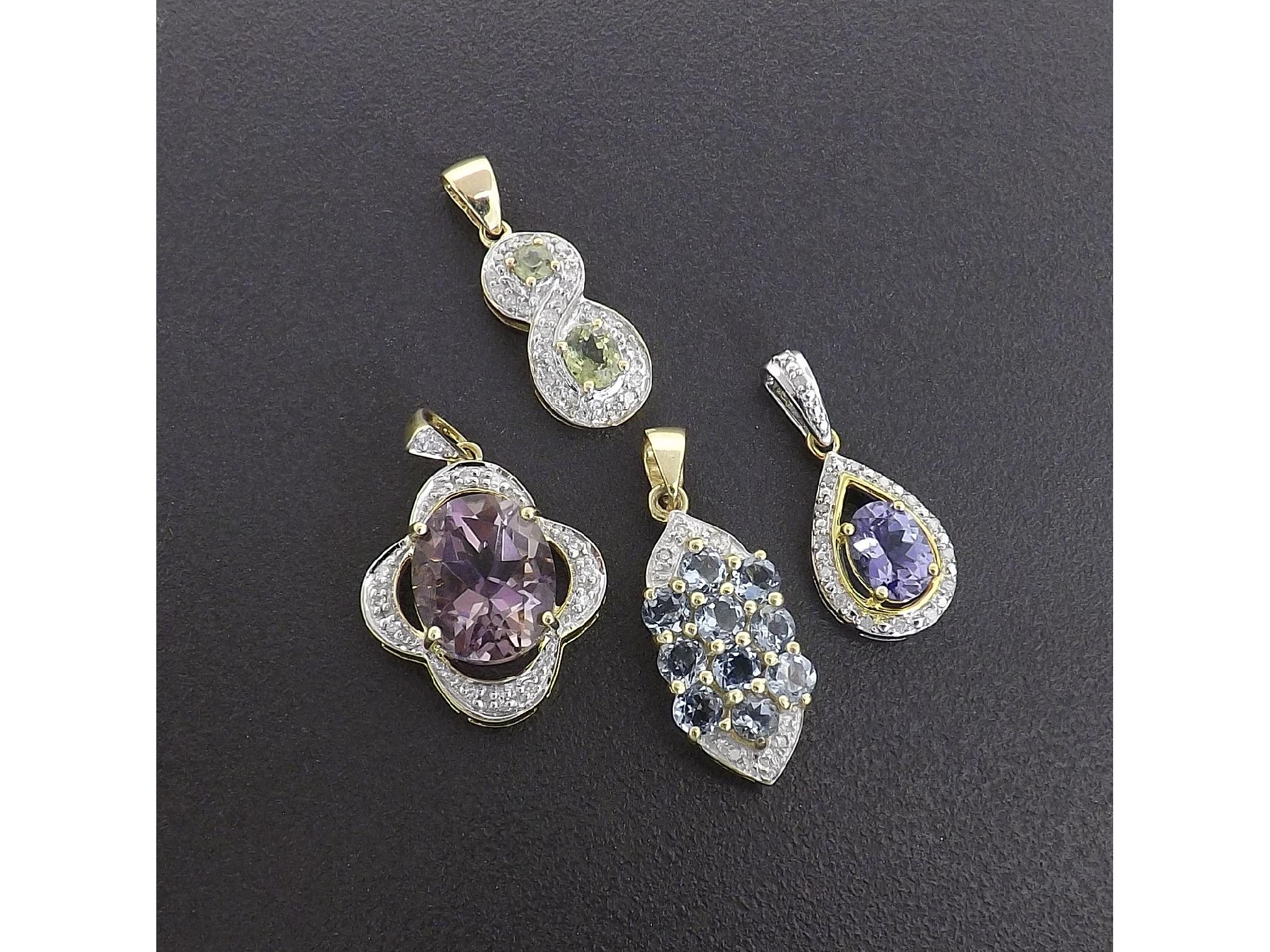 Appraisal: - -a Four diamond and gem set pendants gm