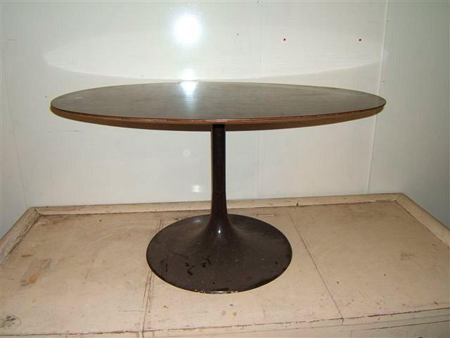 Appraisal: A brown formica oval topped Knoll table with metal support