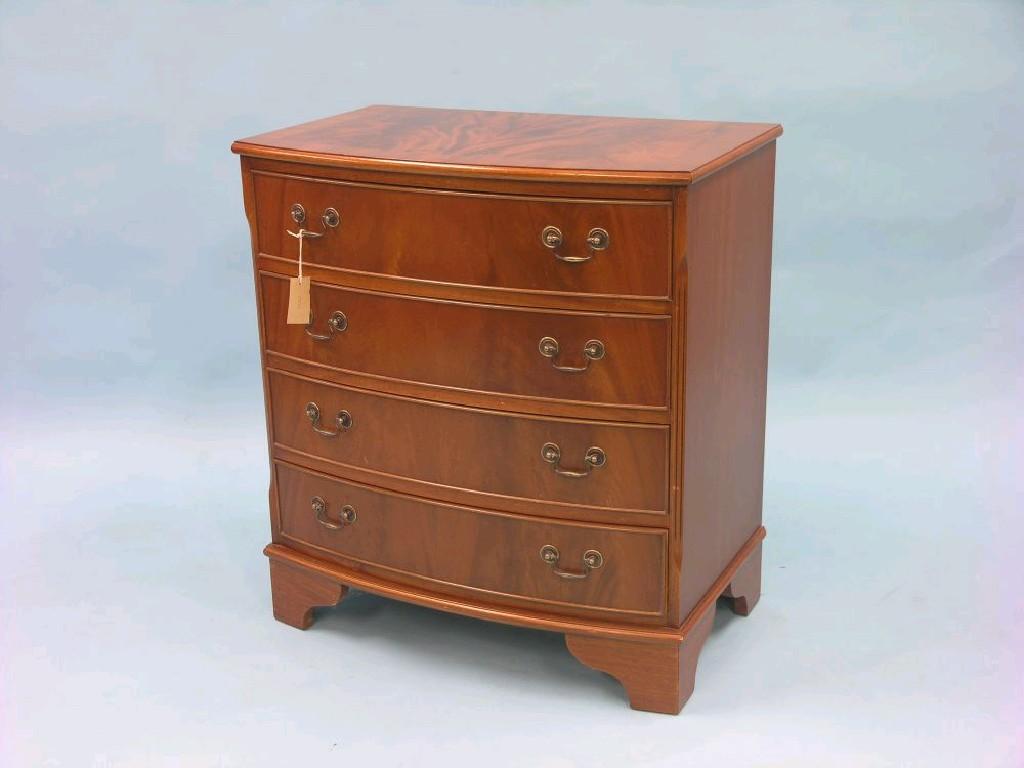 Appraisal: A Georgian-style bow-fronted mahogany bedroom chest cross-banded top above four