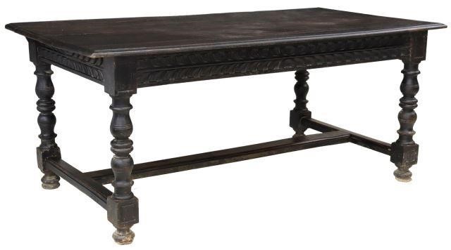 Appraisal: Spanish ebonized oak table th c plank top carved apron