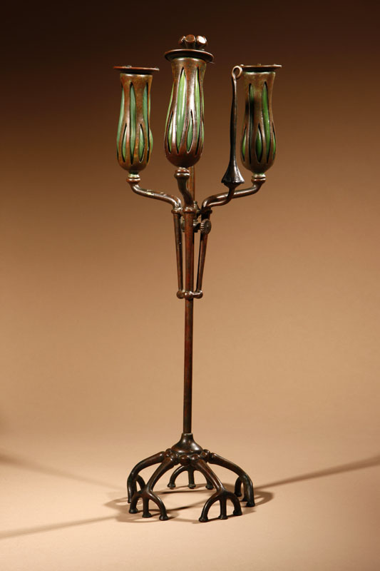 Appraisal: A Tiffany Studios patinated bronze and blown-out glass adjustable root