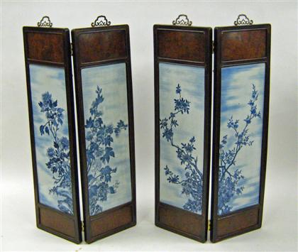 Appraisal: Chinese hardwood and porcelain four-fold panel screen The upper and