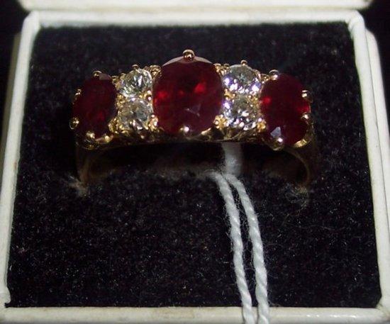 Appraisal: A Victorian ruby and diamond five-stone ring with gold shank