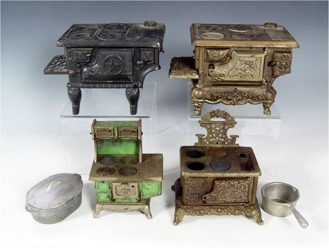 Appraisal: COLLECTION OF CHILDS CAST IRON TOY STOVES To include ''Favorite''