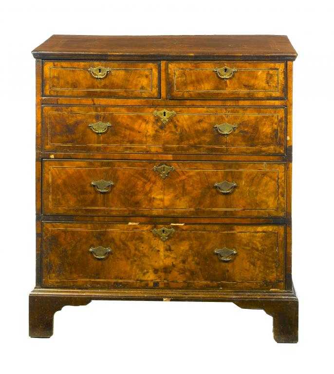 Appraisal: A GEORGE II WALNUT CHEST OF DRAWERS the crossbanded and