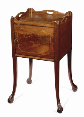 Appraisal: A George III mahogany bedside cupboard the shaped gallery with