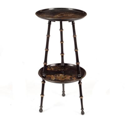 Appraisal: An Edwardian black and gold lacquer two-tier table decorated warriors