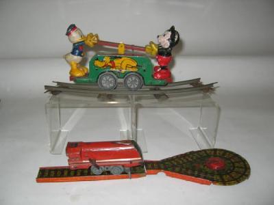 Appraisal: A Marx Mickey and Donald clockwork railway Dandy tin printed