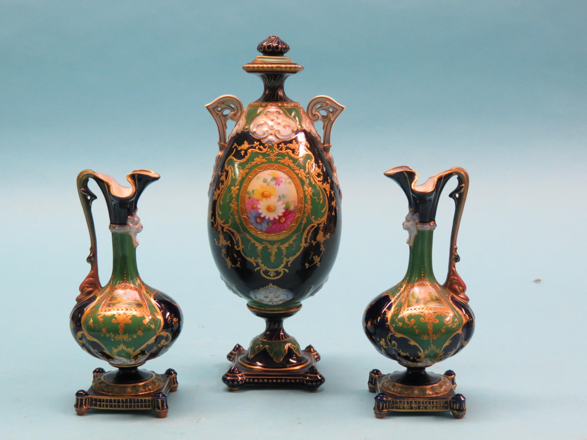 Appraisal: A near-matching th century French mantel garniture two-handled vase painted