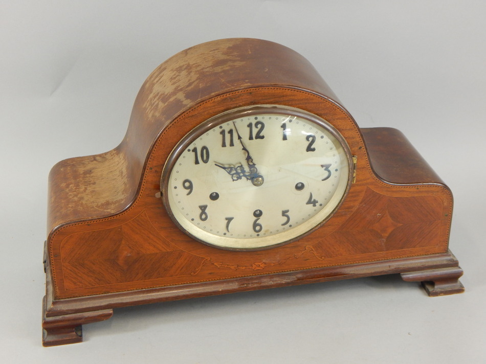 Appraisal: An early thC mahogany and marquetry mantel clock the oval