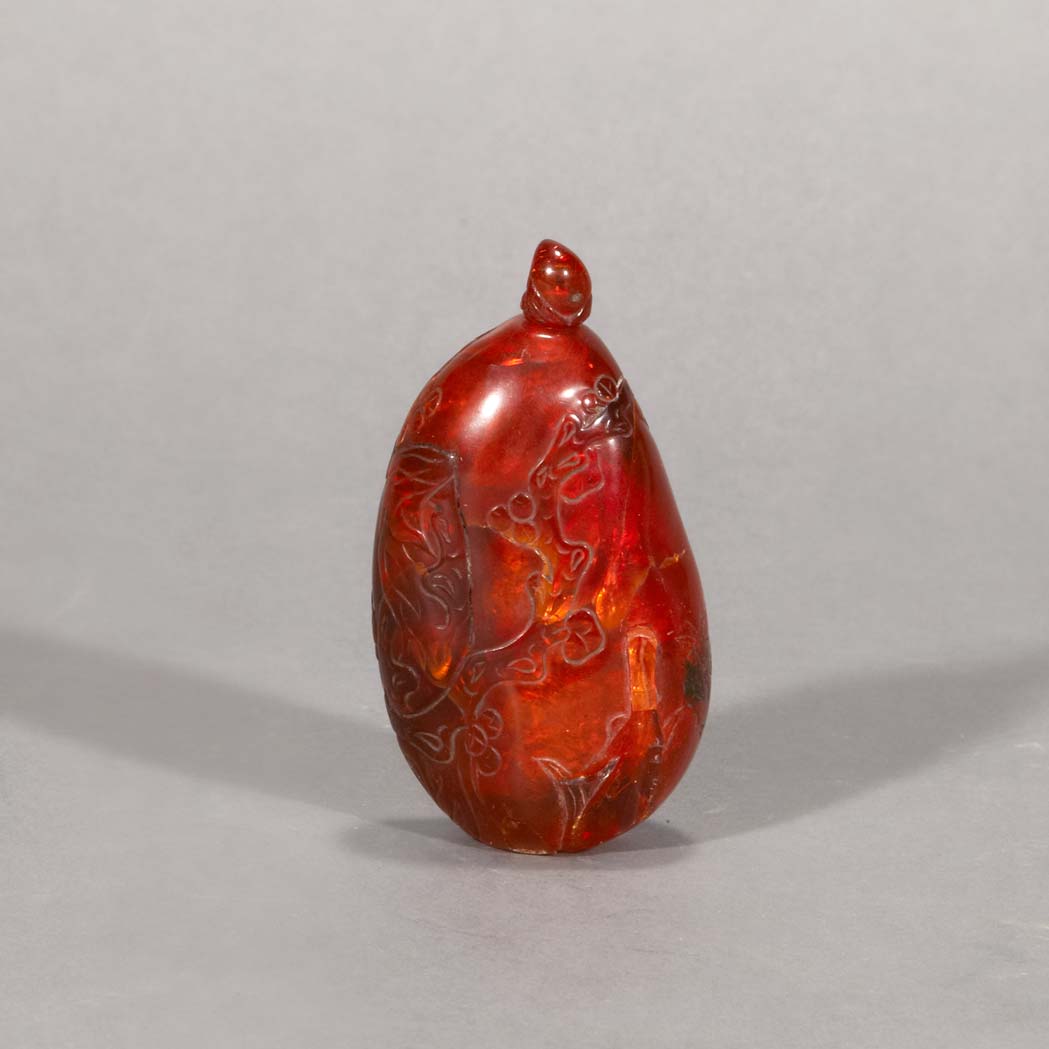 Appraisal: Chinese Amber Snuff Bottle Early th century The natural pebble