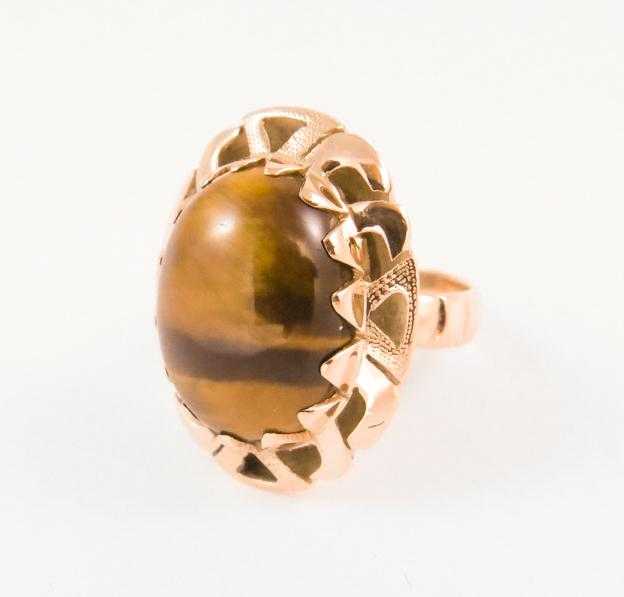 Appraisal: TIGER'S EYE AND FOURTEEN KARAT GOLD RING set with a