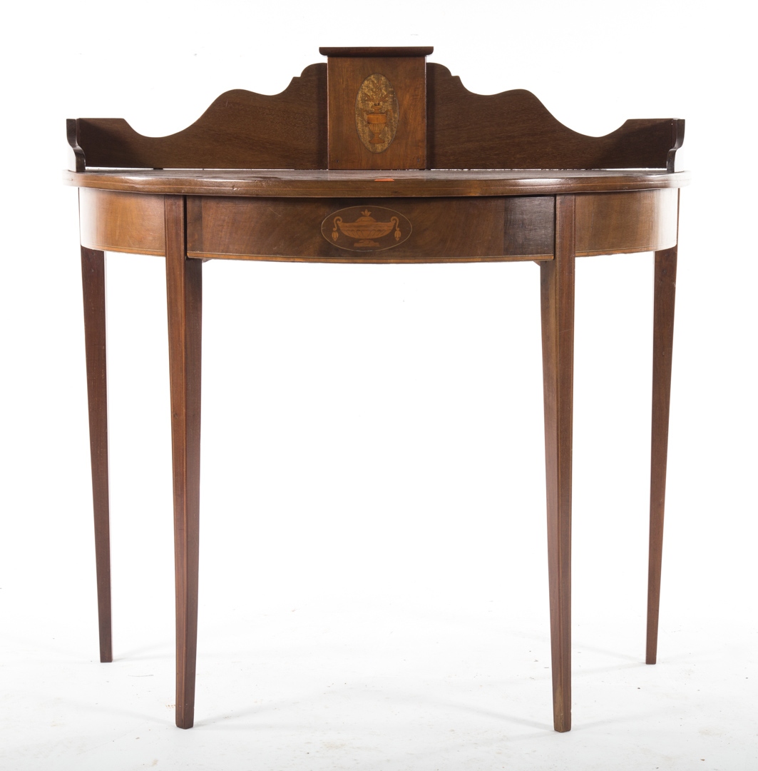 Appraisal: Federal style inlaid mahogany console table demilune form shaped urn