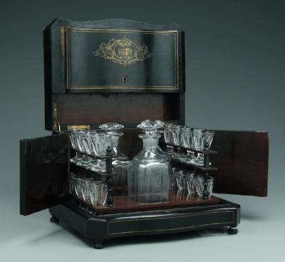 Appraisal: Brass inlaid spirits case three clear in decanters with matching