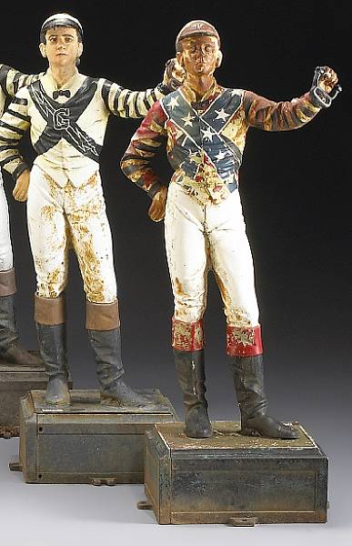 Appraisal: A pair of American painted cast iron lawn jockeys first