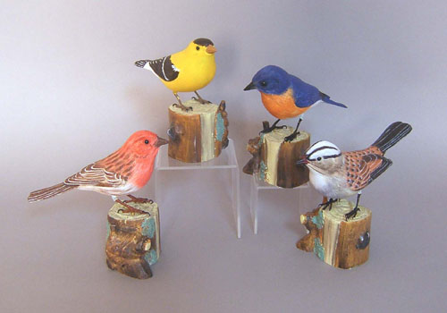 Appraisal: Four carved and painted birds tallest - h Provenance Collection