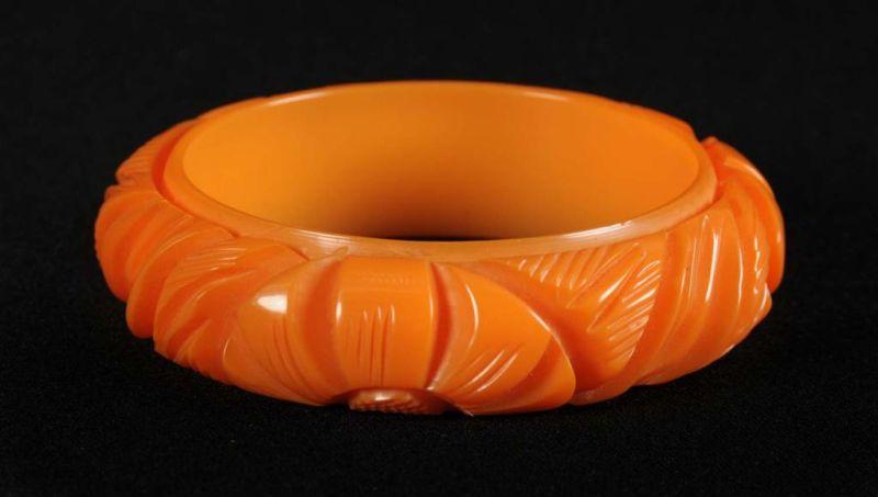 Appraisal: Bakelite Deeply Carved Orange Floral Bracelet Condition Near Mint Size