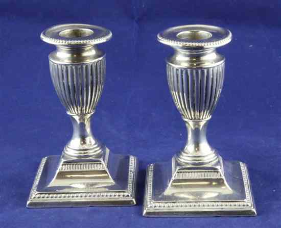 Appraisal: A pair of late Victorian silver dwarf candlesticks with fluted