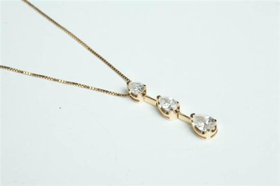 Appraisal: DIAMOND PENDANT Yellow gold necklace with three graduated pear shaped