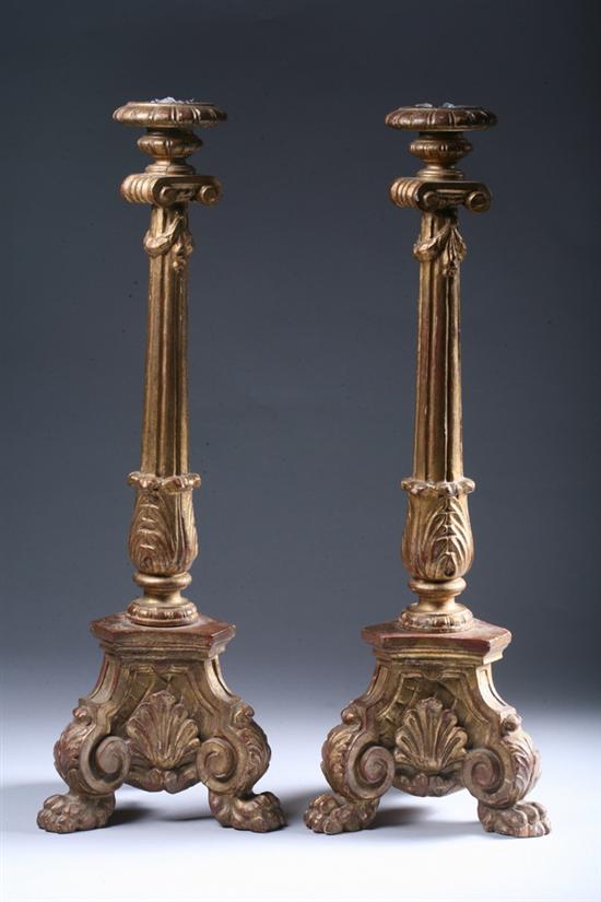 Appraisal: PAIR ITALIAN NEO-CLASSICAL STYLE CARVED AND GILT-WOOD CANDLESTICKS mid- th