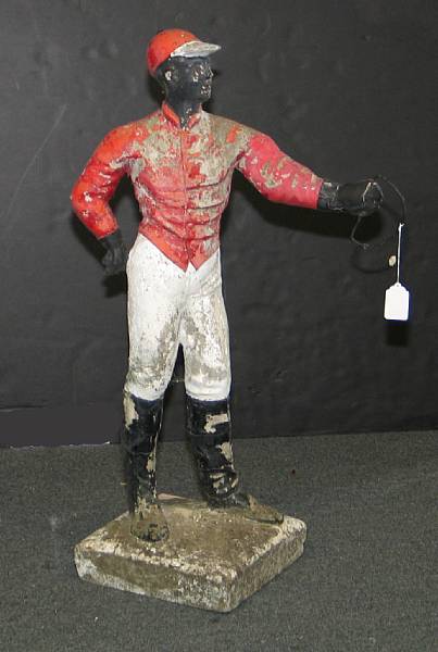 Appraisal: A painted cast stone 'cavalier spirit' lawn jockey height in