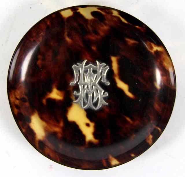 Appraisal: A circular tortoiseshell dish applied with a silver monogram cm