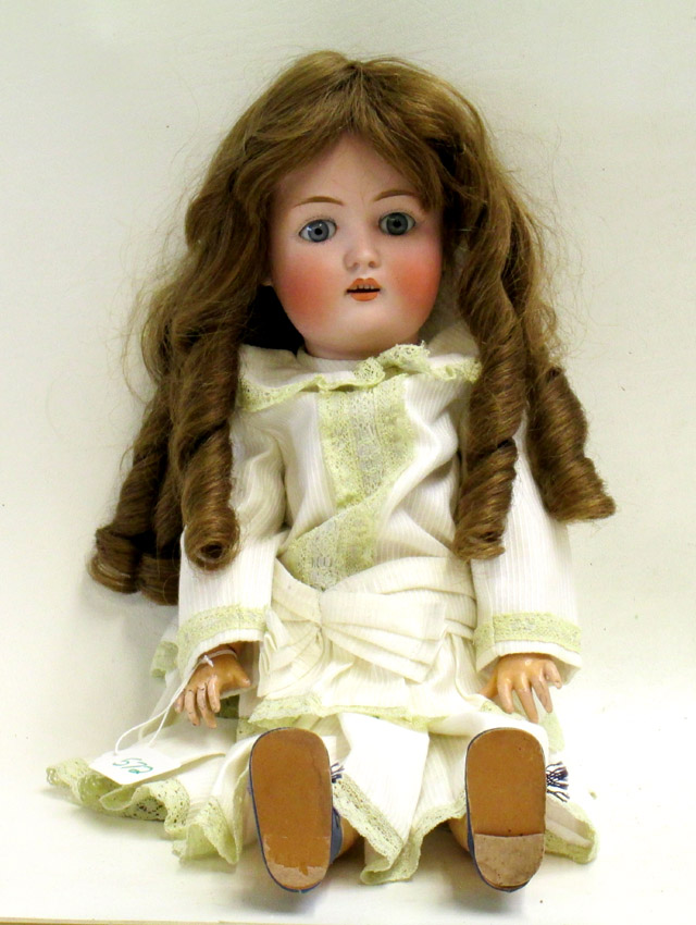 Appraisal: GERMAN BISQUE SOCKET HEAD DOLL with blue sleep eyes and