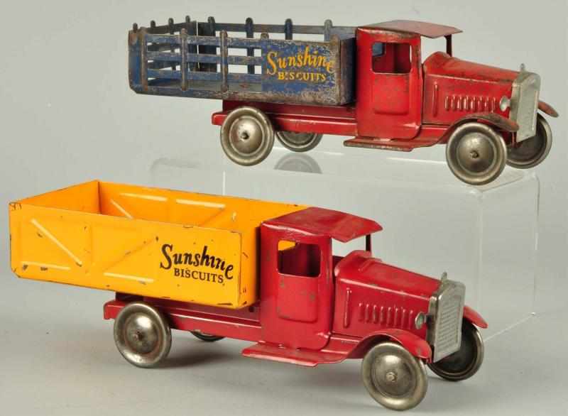 Appraisal: Lot of Pressed Steel Sunshine Biscuit Trucks Description Metalcraft Includes