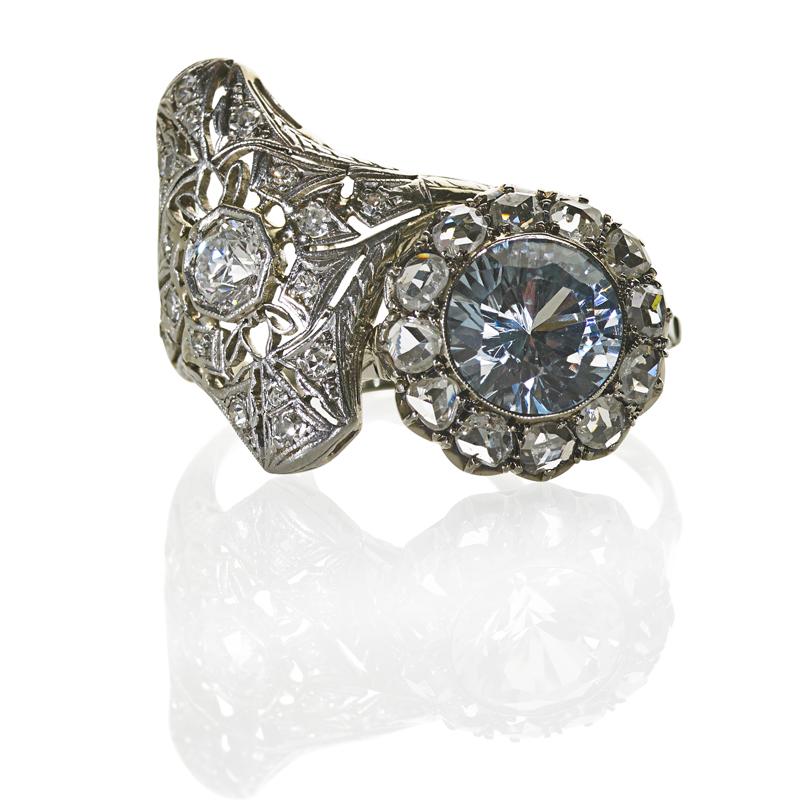 Appraisal: TWO ART DECO RINGS WITH DIAMONDS Navette shaped platinum filigree