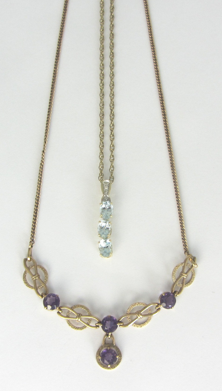 Appraisal: A gold and amethyst set necklace the front claw set