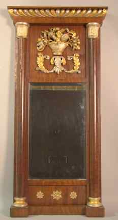 Appraisal: CONTINENTAL MAHOGANY AND PARCEL GILT MIRROR circa with gilded gadrooned