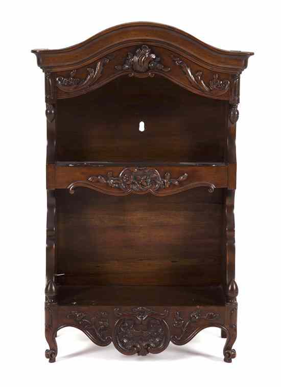 Appraisal: A Victorian Walnut Hanging Etagere having an arched top over