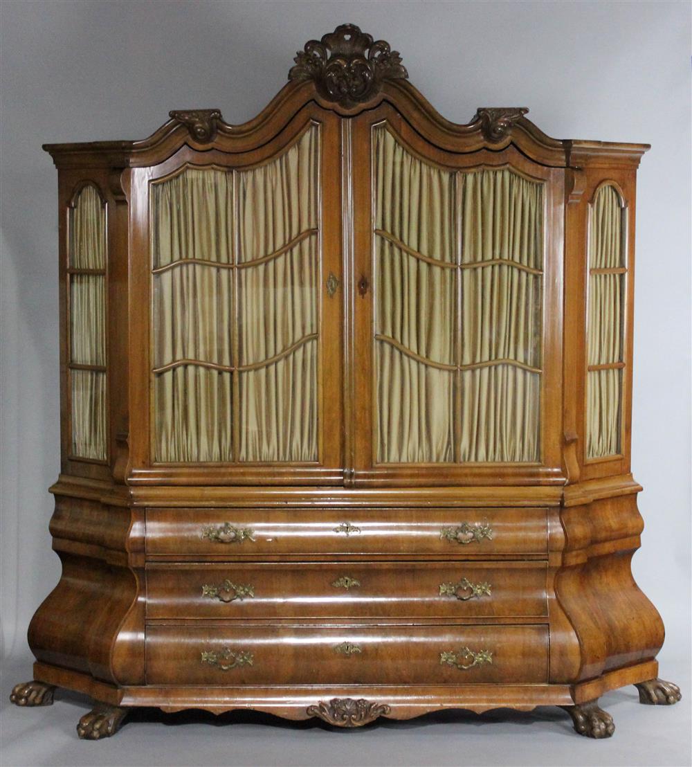 Appraisal: DUTCH BAROQUE STYLE WALNUT BOMBE FORM TWO PART CABINET late