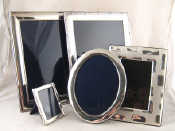 Appraisal: Two large silver plated photo frames each x cm another