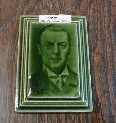 Appraisal: A small green glazed portrait tile by Craven Dunhill Co