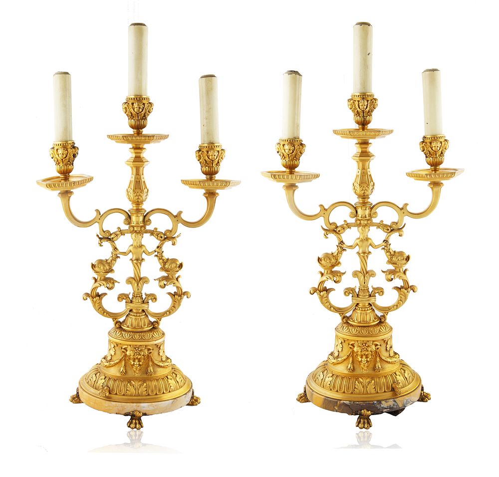 Appraisal: A PAIR OF BRONZE THREE-LIGHT ELECTRIFIED CANDELABRAS A PAIR OF