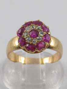 Appraisal: A yellow metal tests ct gold ruby and diamond cluster