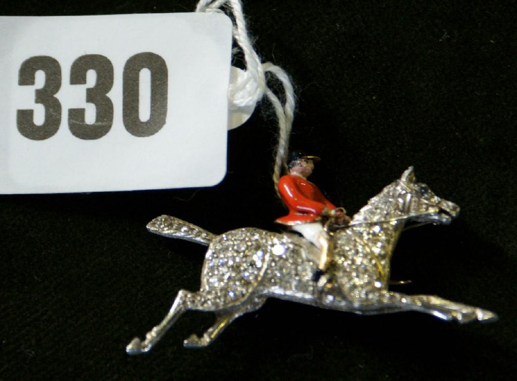 Appraisal: A diamond huntsman brooch circa the galloping horse set with