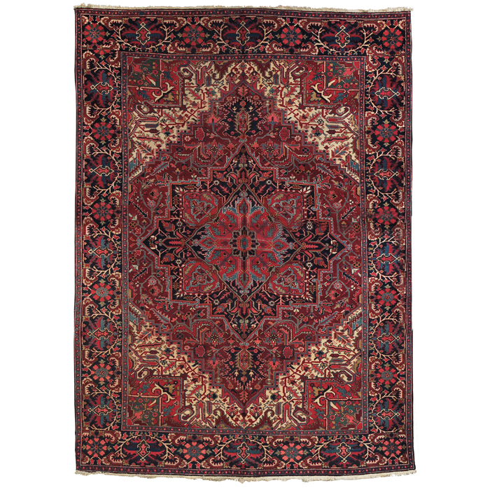 Appraisal: Persian Heriz rug c floral design on a red field