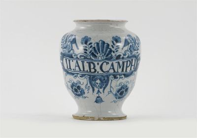 Appraisal: A delftware dry drug jar typically decorated with two cherubs