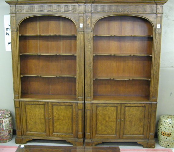 Appraisal: A PAIR OF OAK BOOKCASES Baker Furniture Co modern The