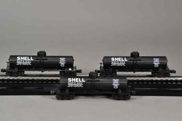 Appraisal: IDENTICAL LIONEL SHELL TANK BOX CARSIncluding three identical black Lionel