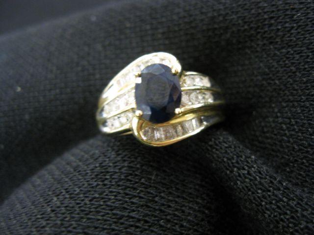 Appraisal: Sapphire Diamond Ring oval deep blue gem weighing carat surrounded