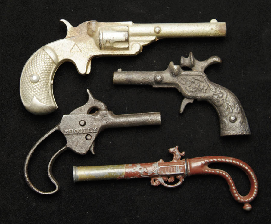 Appraisal: LOT OF FOUR CAST IRON CAP GUNS Including a Ideal